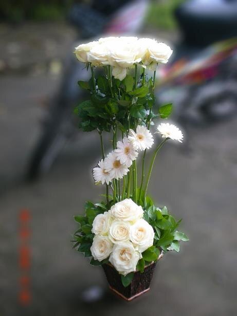 Orange round bouquet from Flower Power Bali catalogue