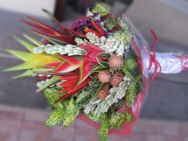 Orange table arrangement from Flower Power Bali catalogue